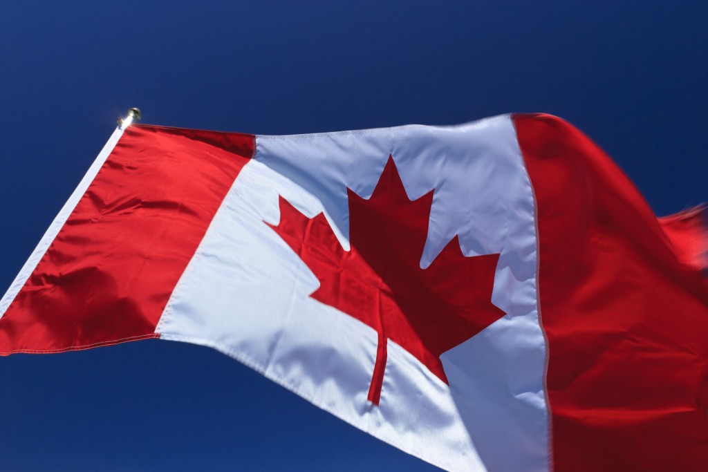 Canadian flag flapping in wind, Vancouver